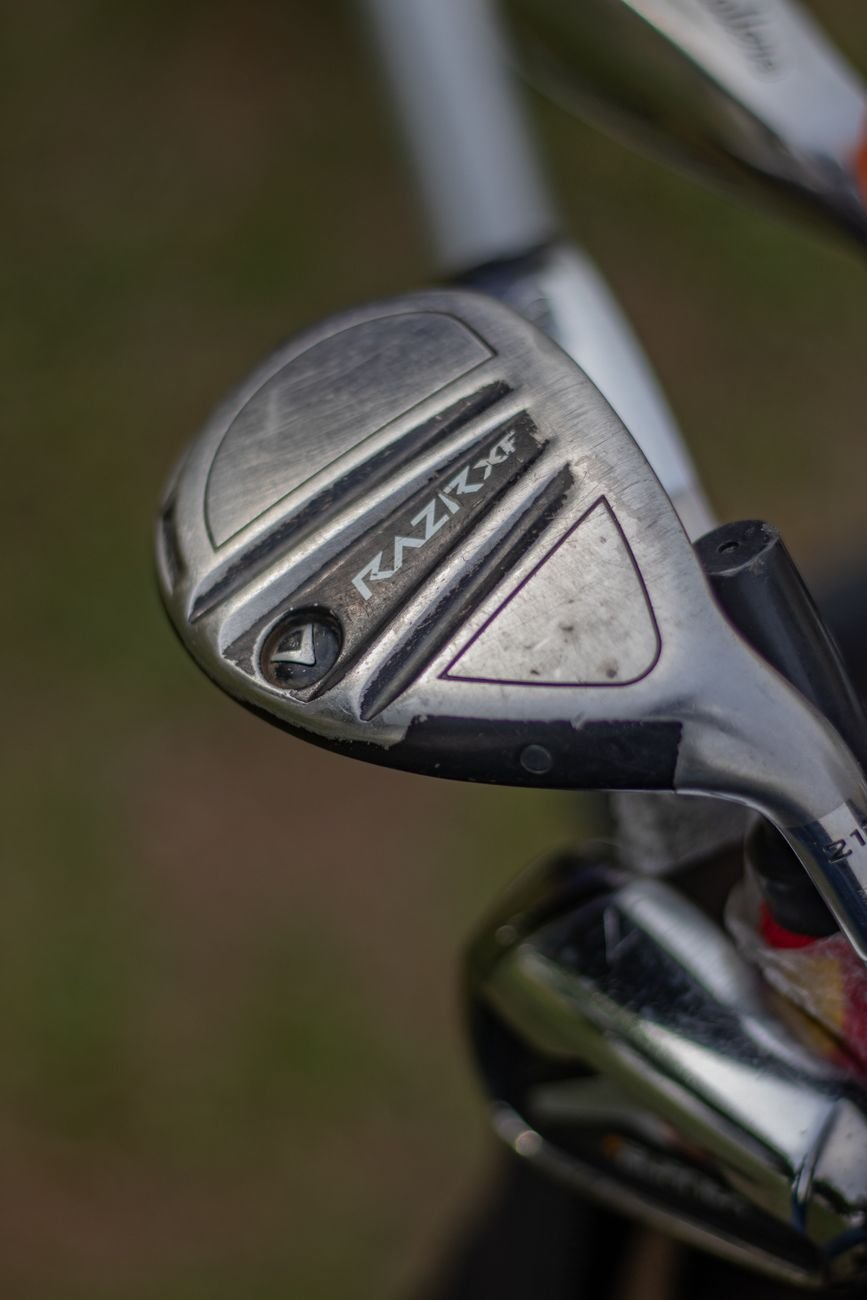 Close-up of a golf clubhead, the spot where lead tape is added to adjust swing weight