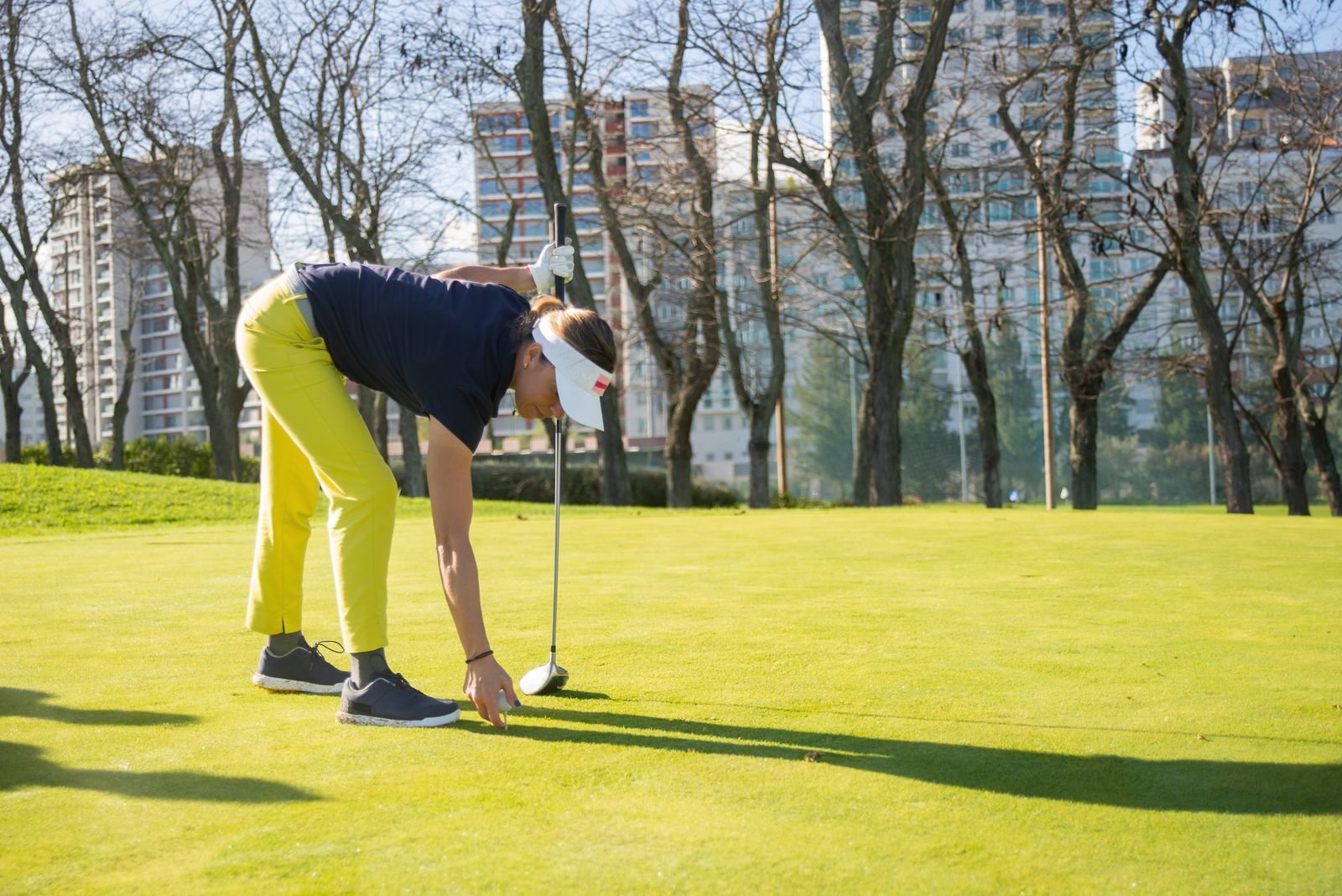 Golfer demonstrating a proper forward hip hinge and bend from the hips