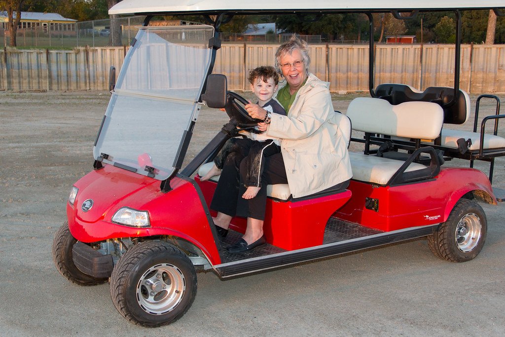 Personal golf cart similar in size to those hauled on a golf cart trailer