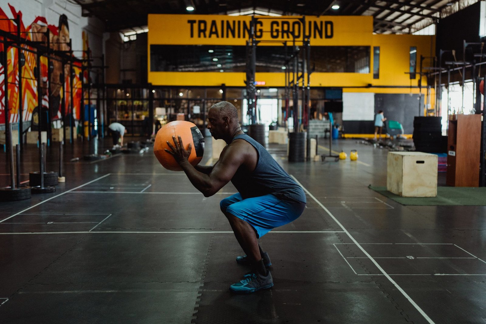 Athlete performing a rotational medicine ball exercise to build core strength for golf swing speed training