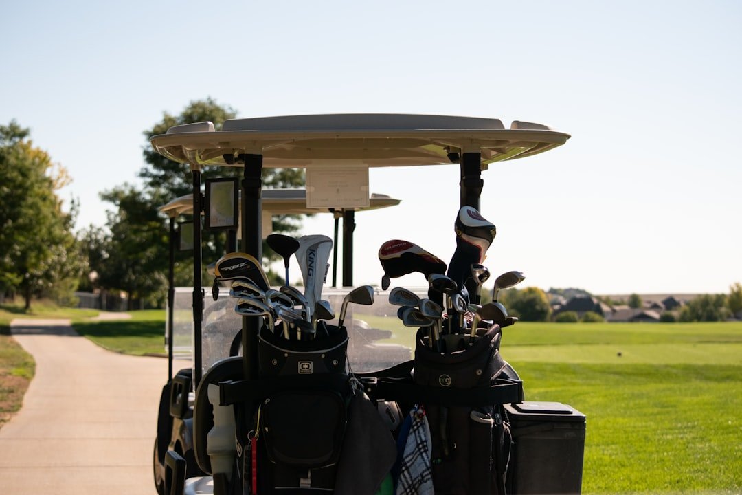 Electric golf cart on the course, powered by its golf cart motor and battery pack