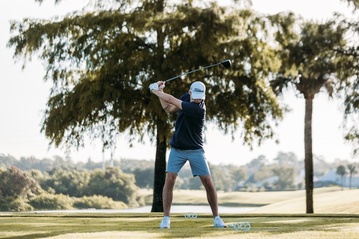 Golfer demonstrating centrifugal force golf swing mechanics during the downswing release