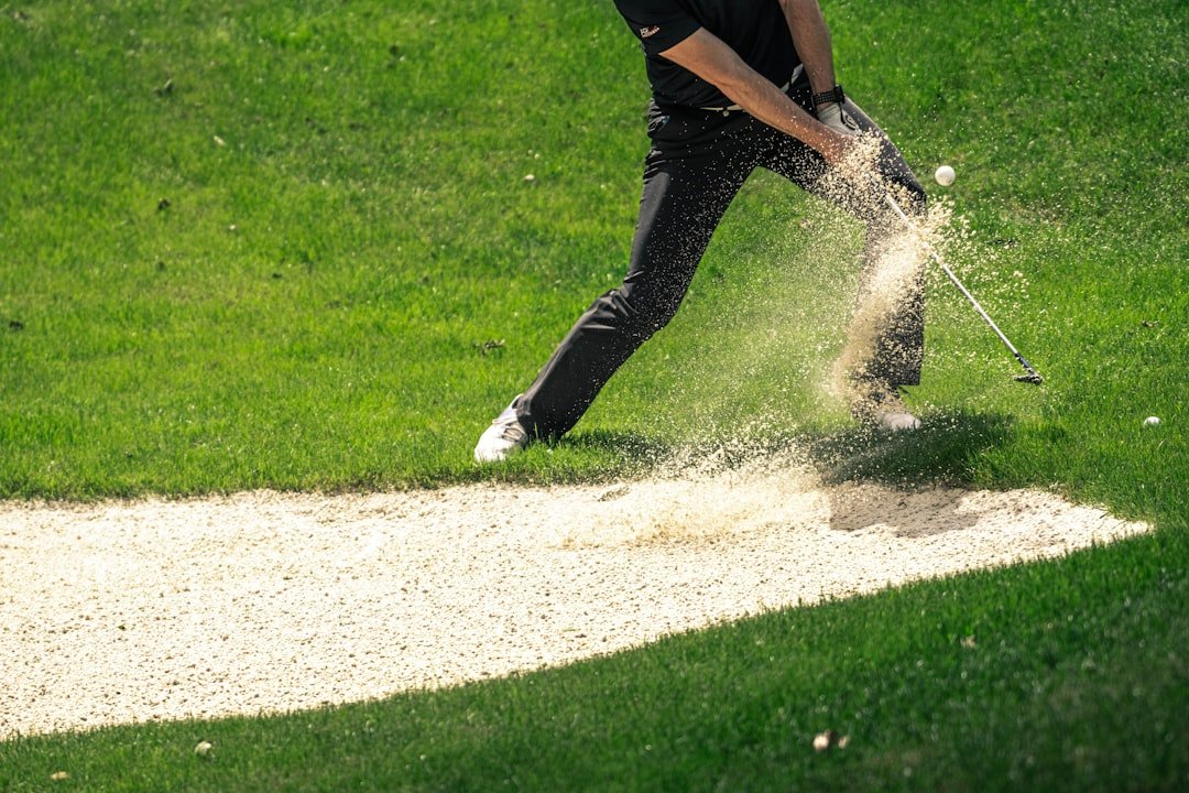 Golfer swinging through impact — sequencing changes 7 iron launch angle and spin