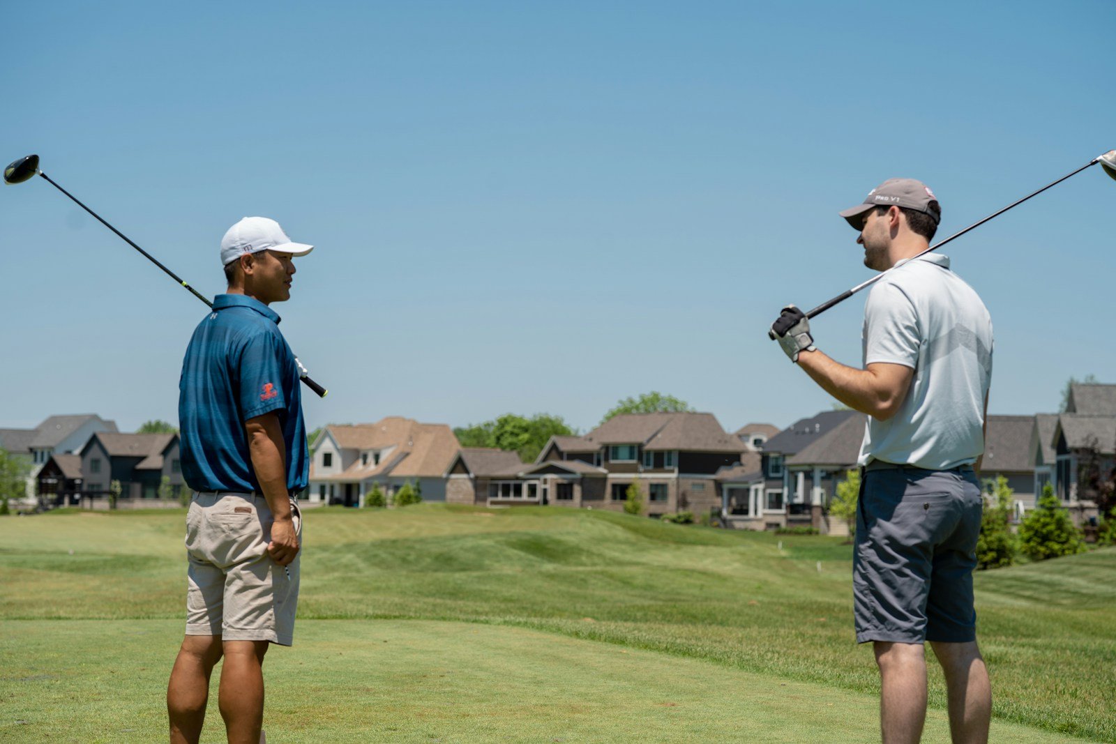 Golfer starting the backswing with a one-piece takeaway, arms and shoulders moving together
