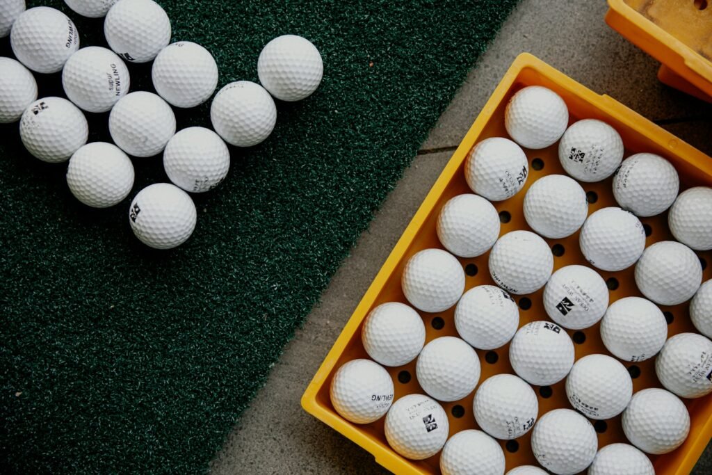 A tray of finished golf balls after manufacturing, cover molding, and quality testing