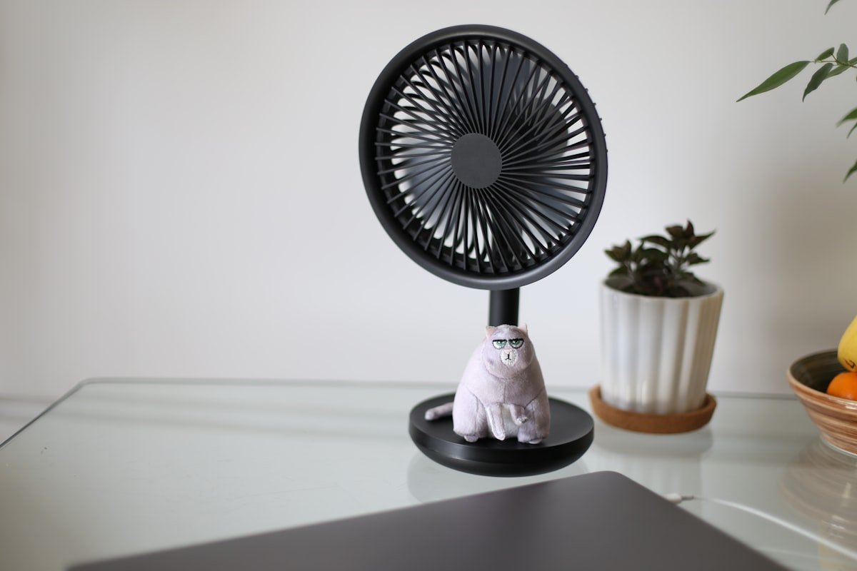 A compact rechargeable fan, similar in style to portable golf cart fans