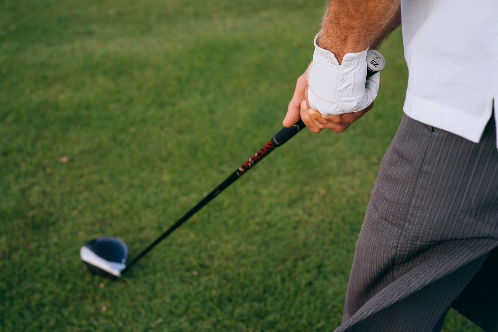 Golfer choosing a smart, conservative shot to protect a low net score