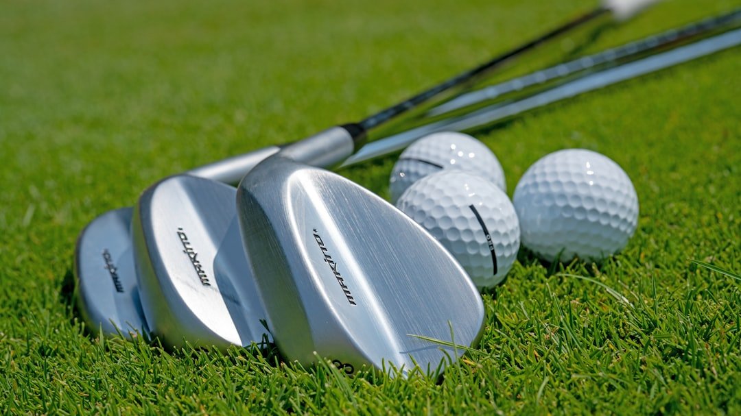 Close-up of high-lofted wedges, the opposite end of the loft spectrum from low lofted golf clubs