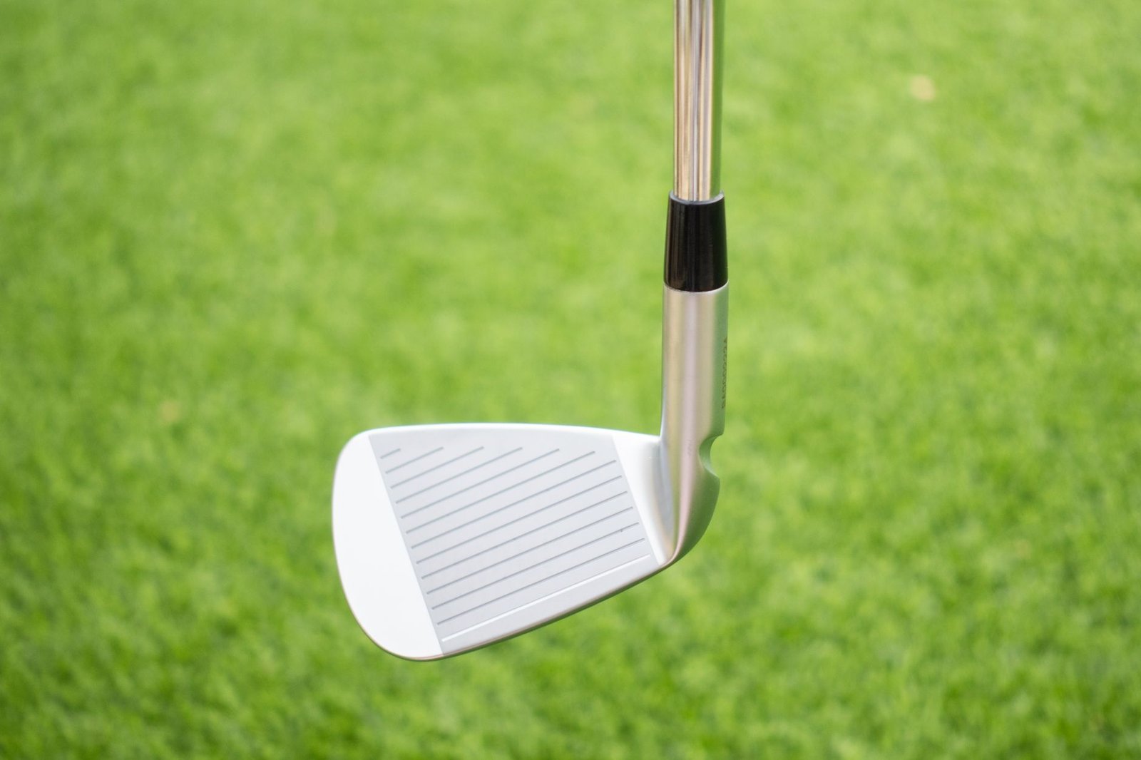 Close-up of a golf iron clubhead, similar to the irons in a Knight golf clubs set