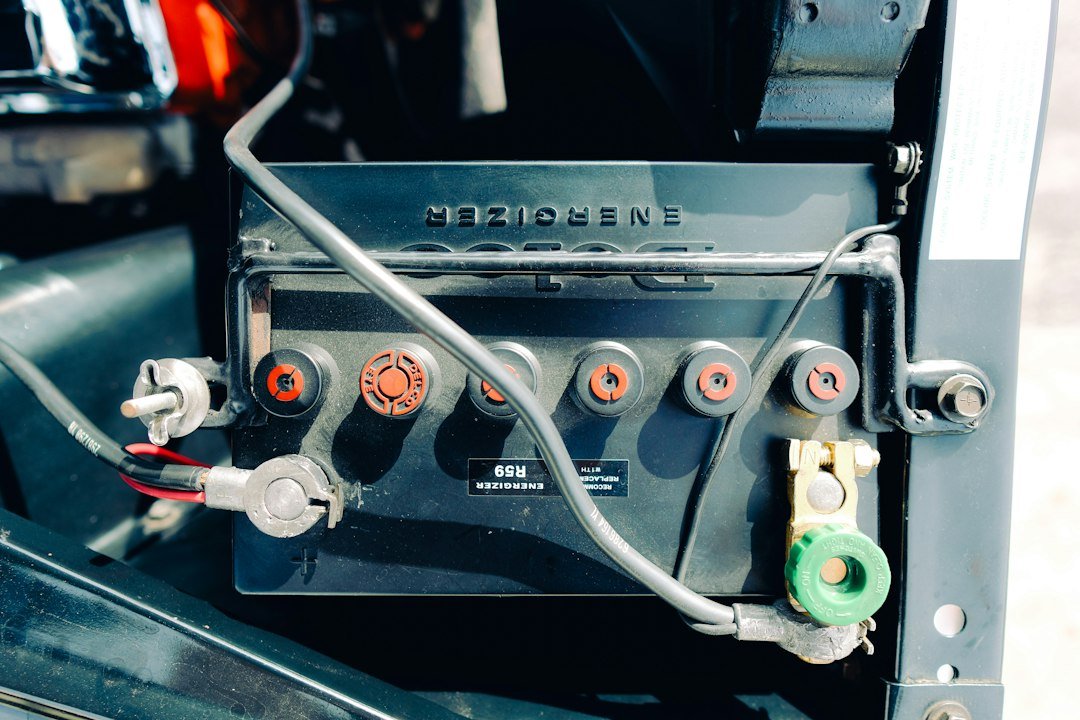 A golf cart battery bank with cable connections running across the frame, a common spot for the short circuit behind a blown fuse.