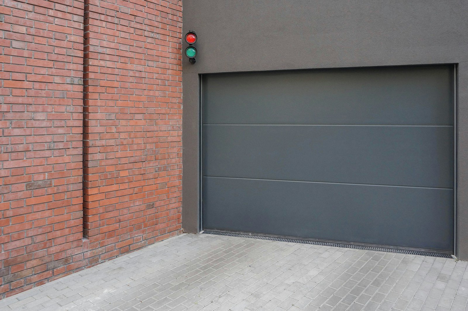 Closed sectional garage door on a residential exterior wall