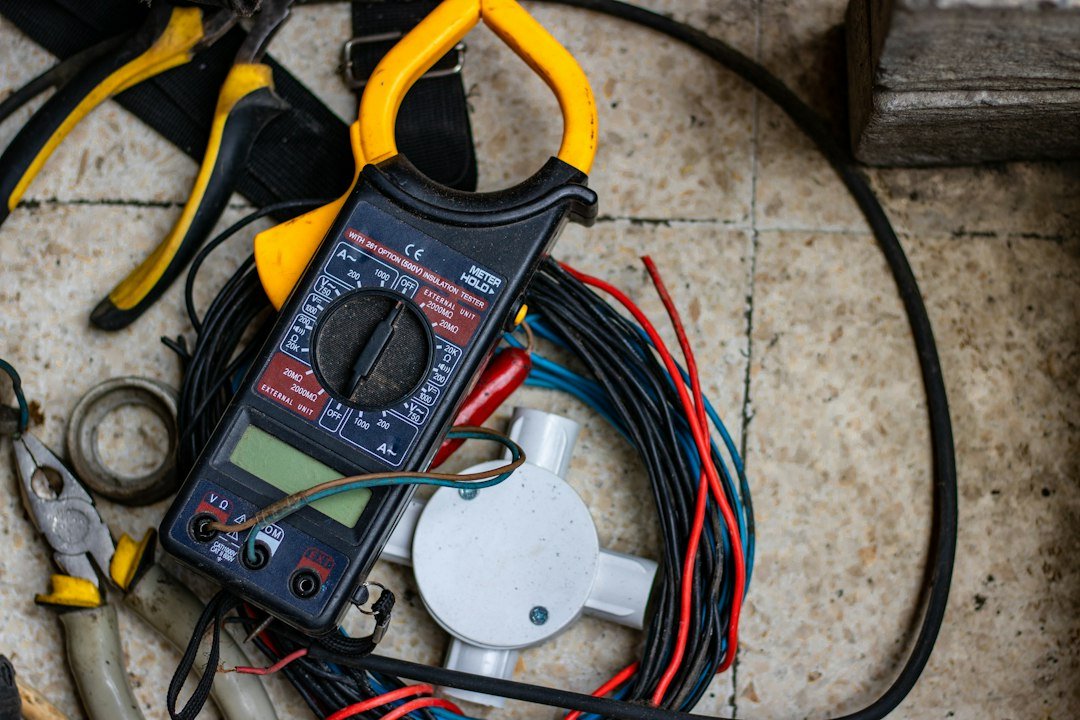 A clamp meter and test leads, the tools used to trace which wire is causing a golf cart to keep blowing fuses.