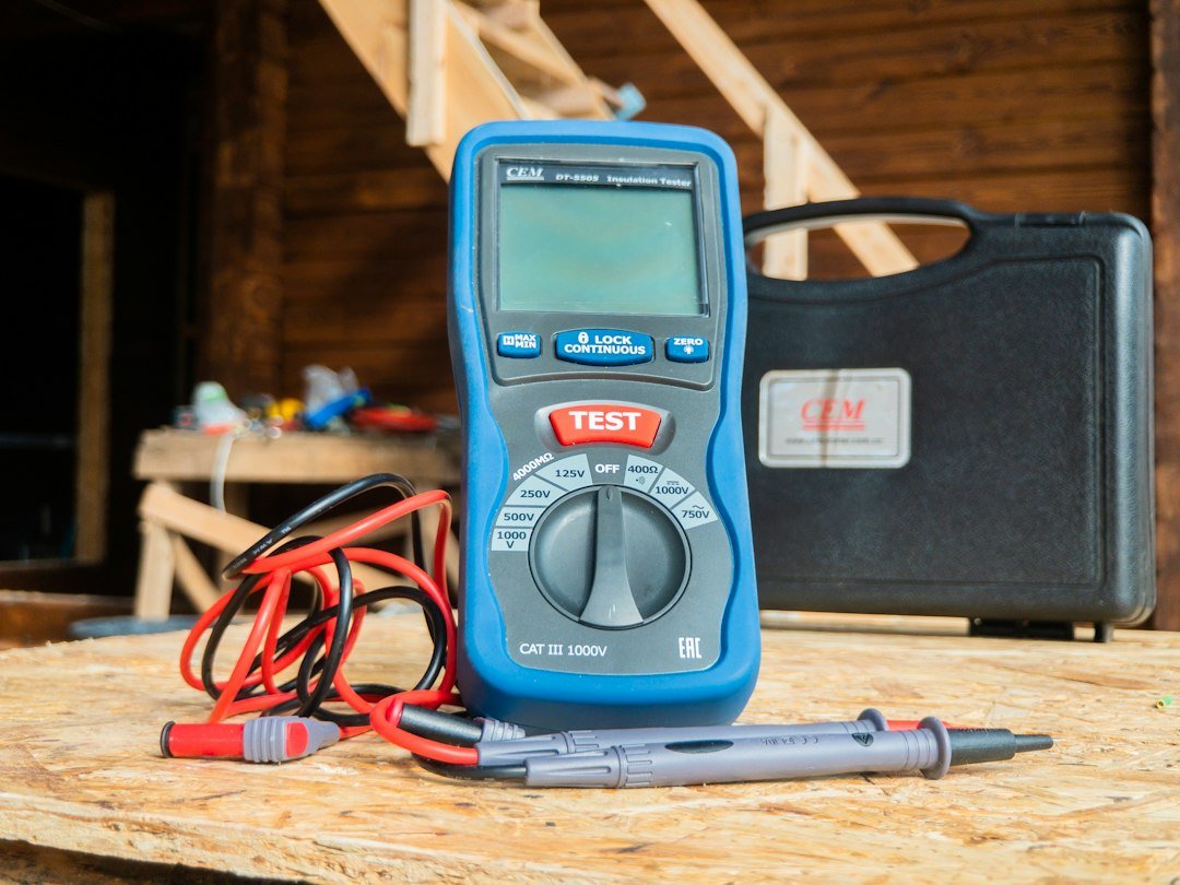 A digital multimeter with test leads, used to check voltage when a golf cart clicks but won't move