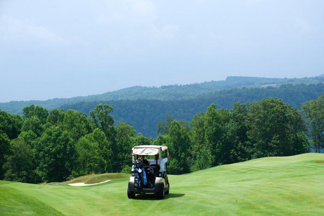 A golf cart heading down a fairway; a golf cart jerks when accelerating for several fixable reasons