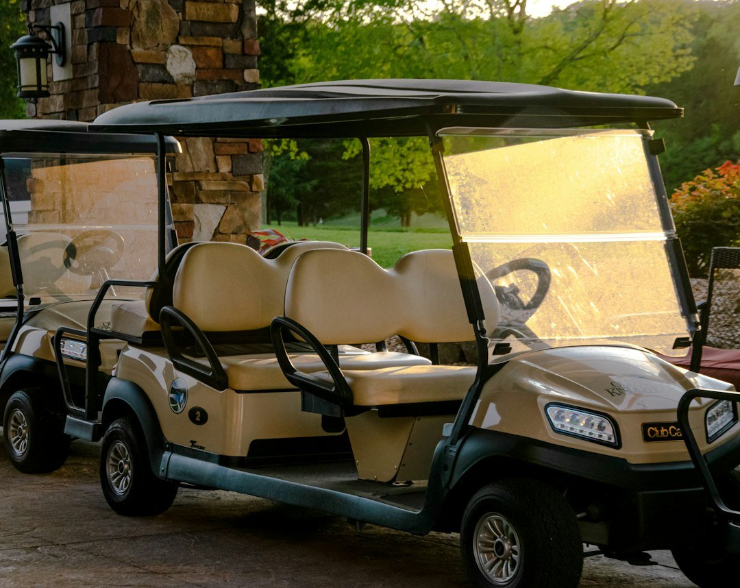 Golf cart with LED headlights parked on a course, the kind of cart where golf cart lights not working is a common complaint