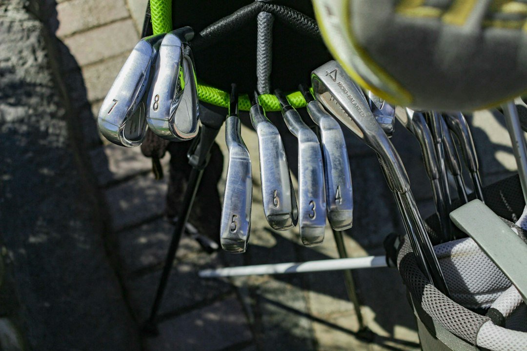A set of irons hanging in a golf bag, ready for a regrip