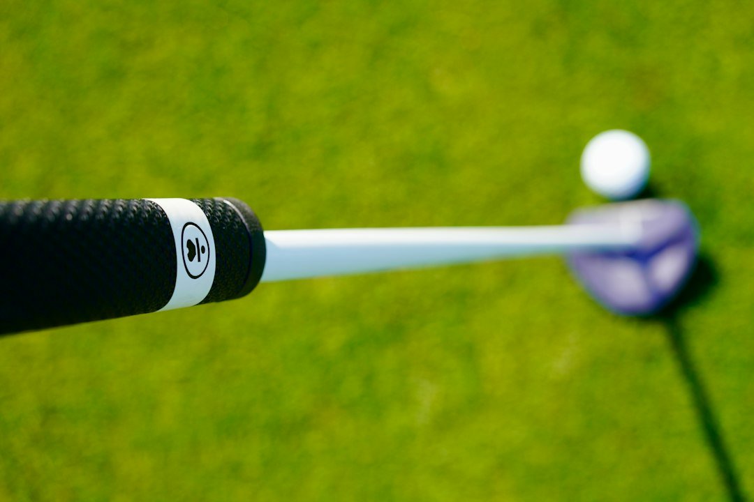 Putter grip and shaft close up, a reminder of how often you should regrip golf clubs