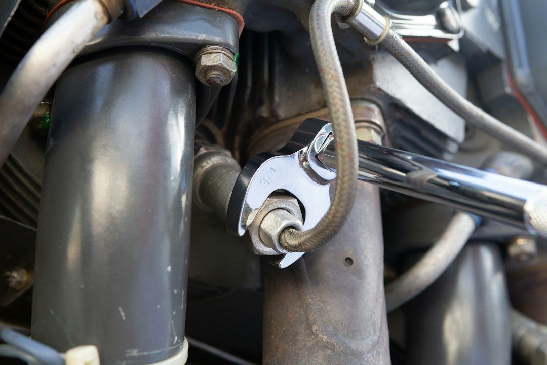 Torque wrench with a crowfoot attachment tightening a nut